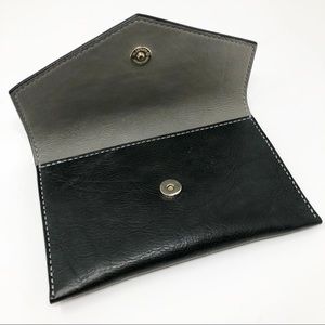 Handmade, hand stitched real leather clutch.